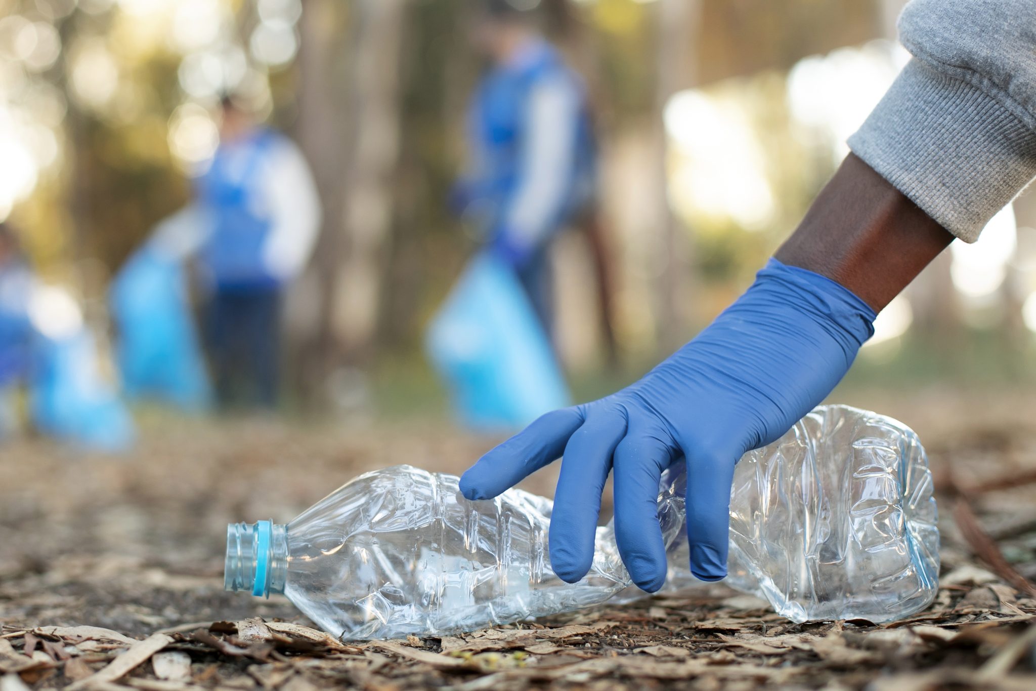 close-up-hand-holding-plastic-bottle