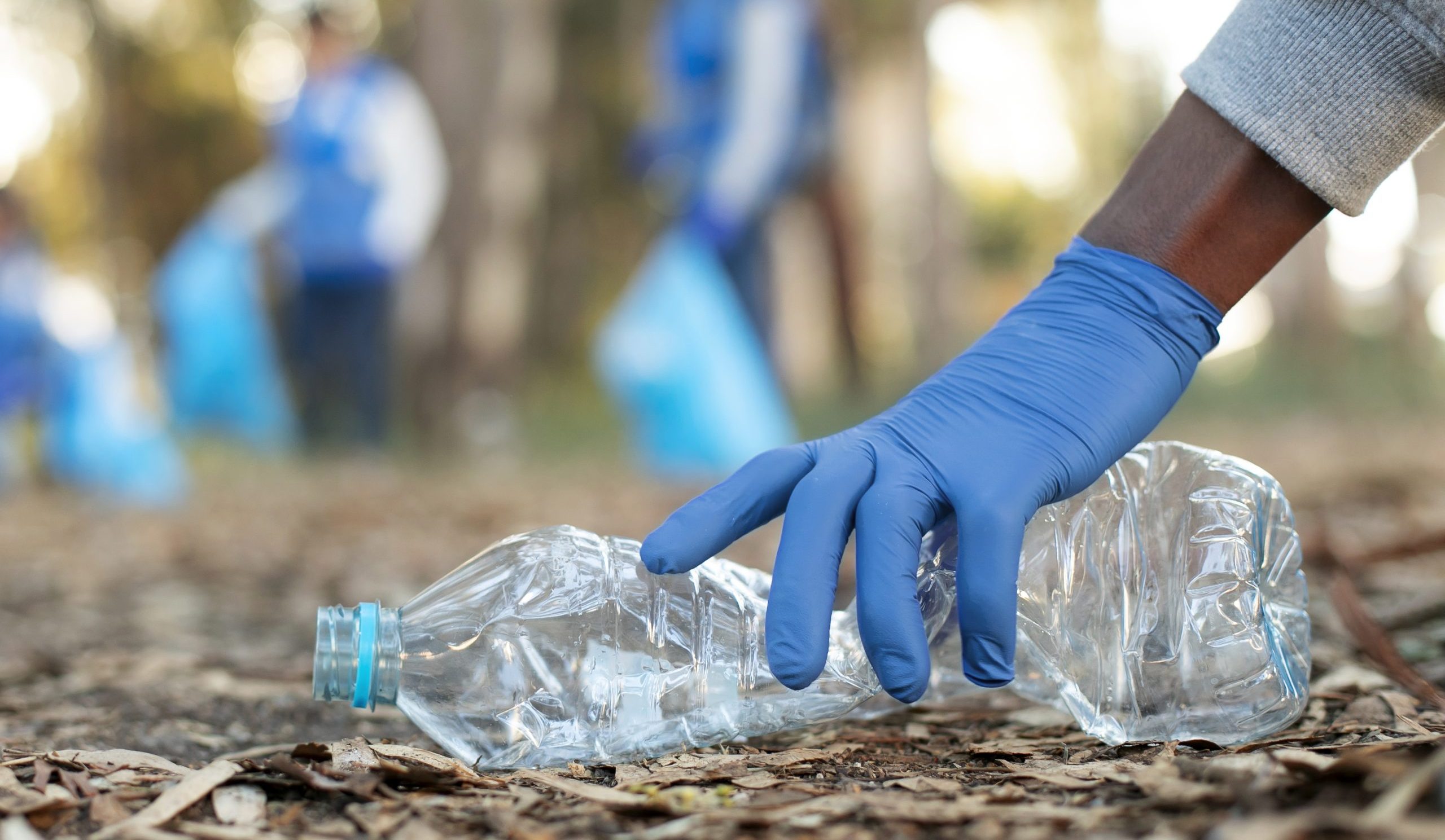 close-up-hand-holding-plastic-bottle